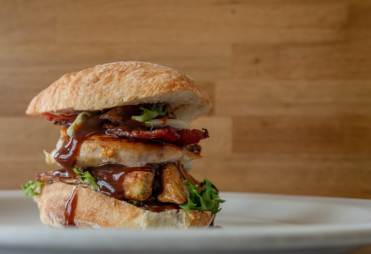 Grilled chicken sandwich with bacon, lettuce, and barbecue sauce — hearty and fast weeknight meal.